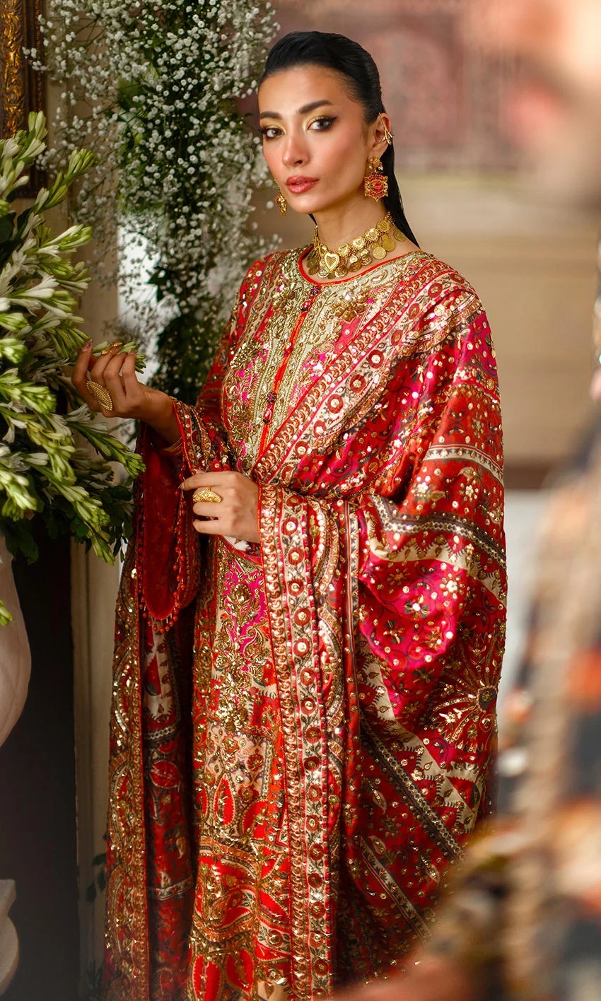 CRIMSON TALE I NOMI ANSARI clothing in gold, red tones.